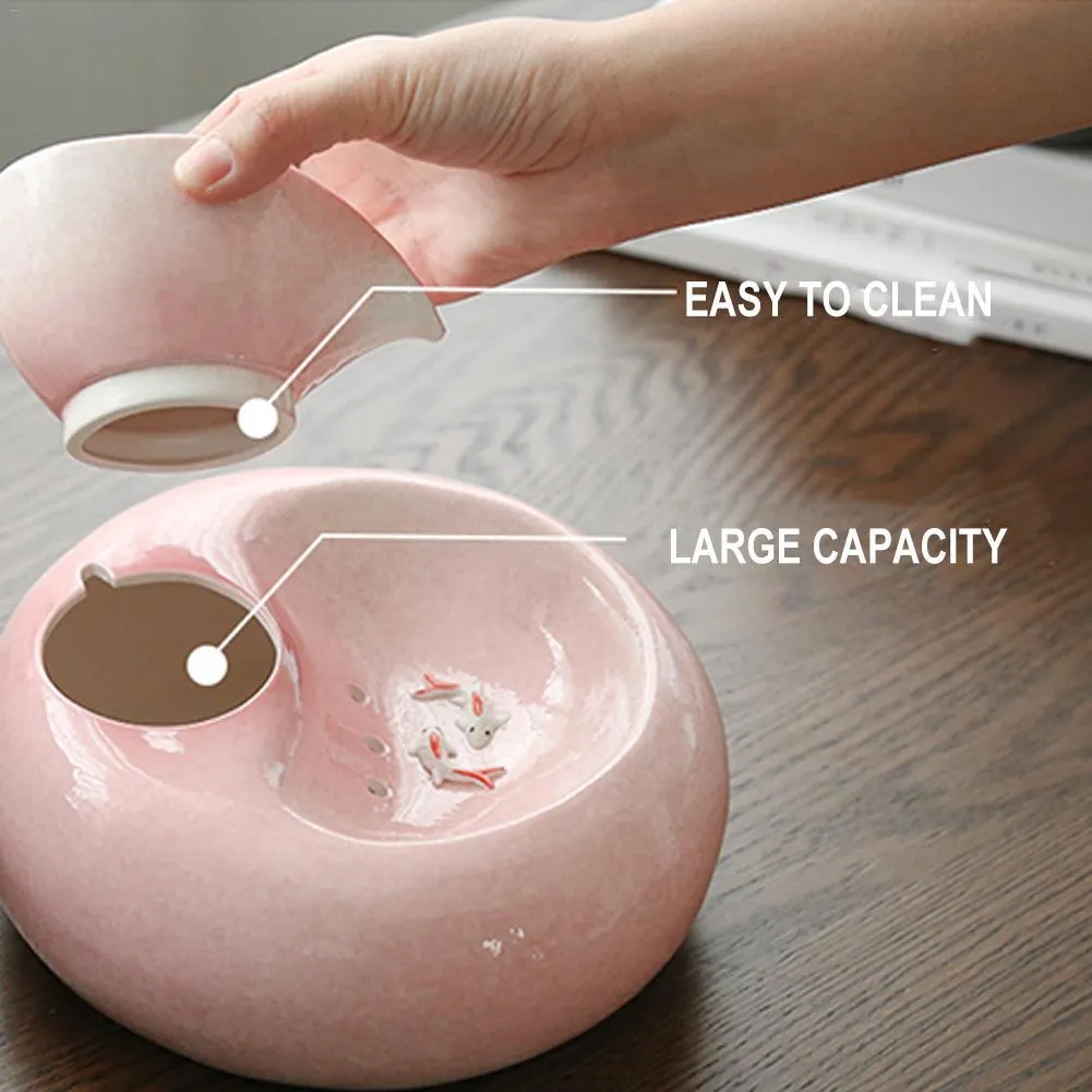 White porcelain leaf-shaped automatic cat water dispenser on floor