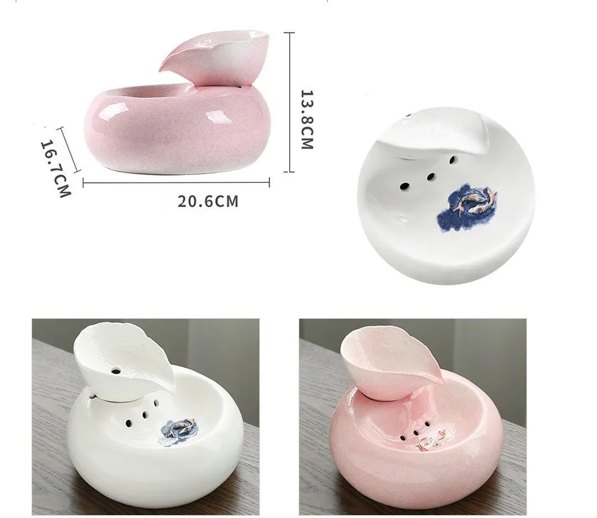 White porcelain leaf-shaped automatic cat water dispenser on floor