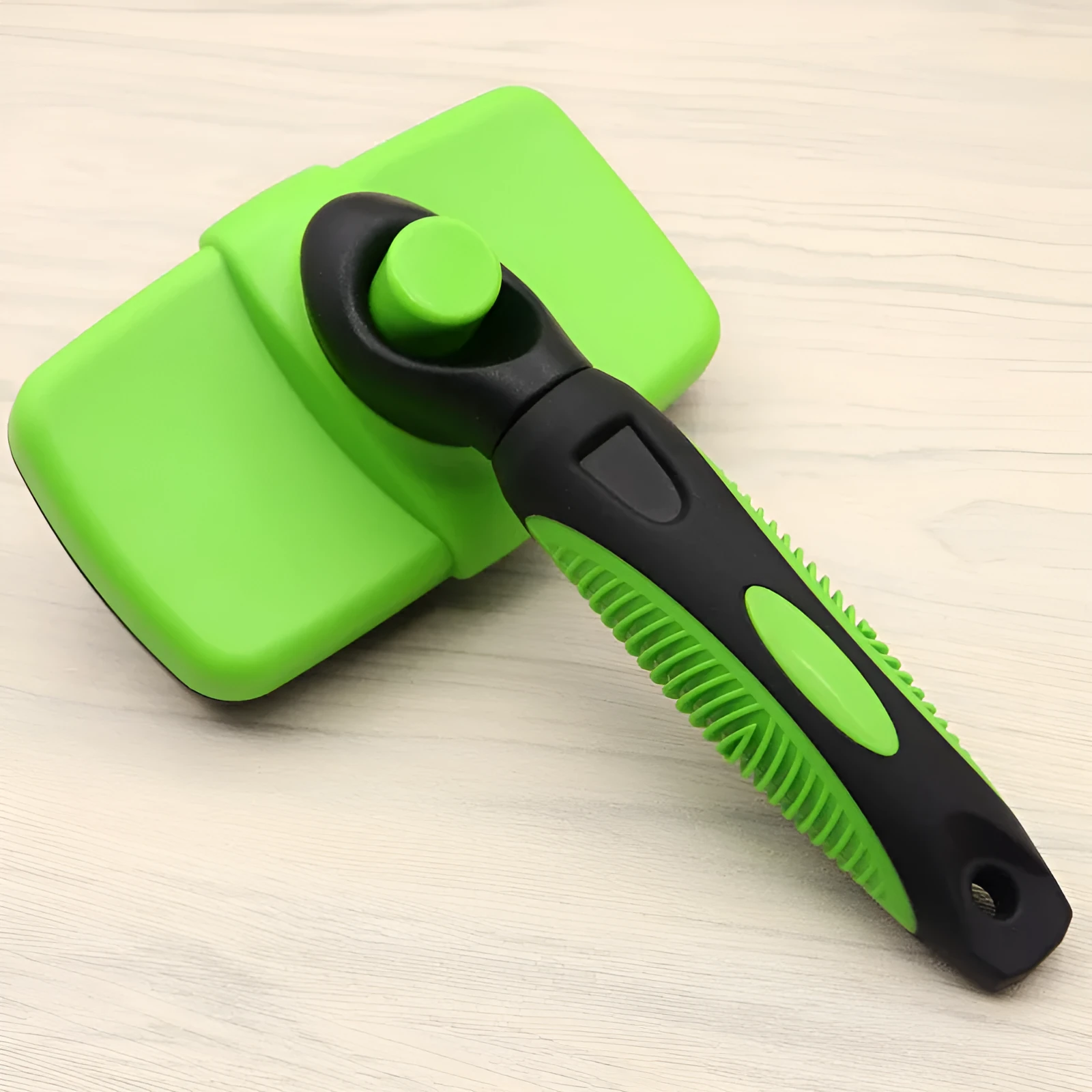 Cat and dog grooming needle comb with stainless steel teeth and dark green ABS TPR handle on white background