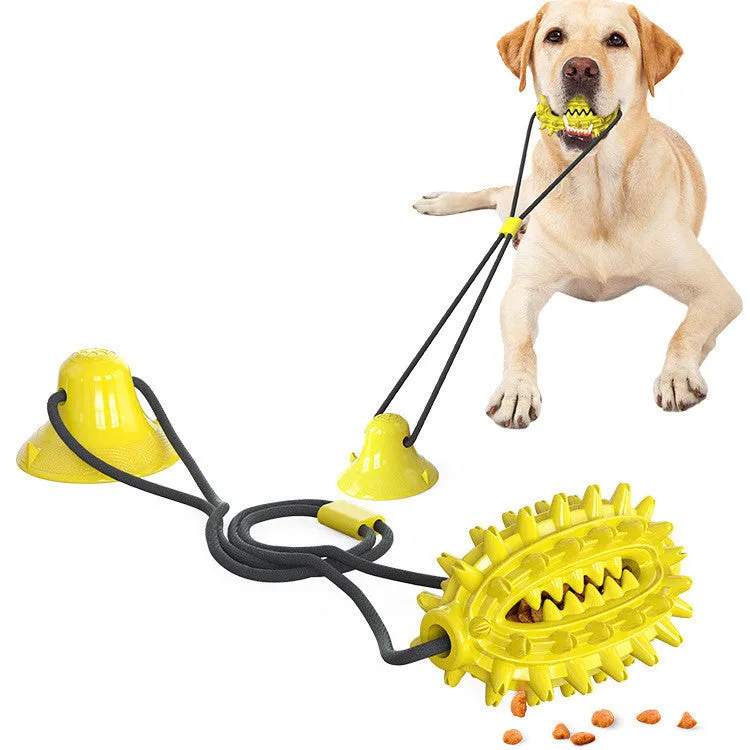 Green TPR sucker dog toy cactus with molar stick and leaking ball on a smooth floor