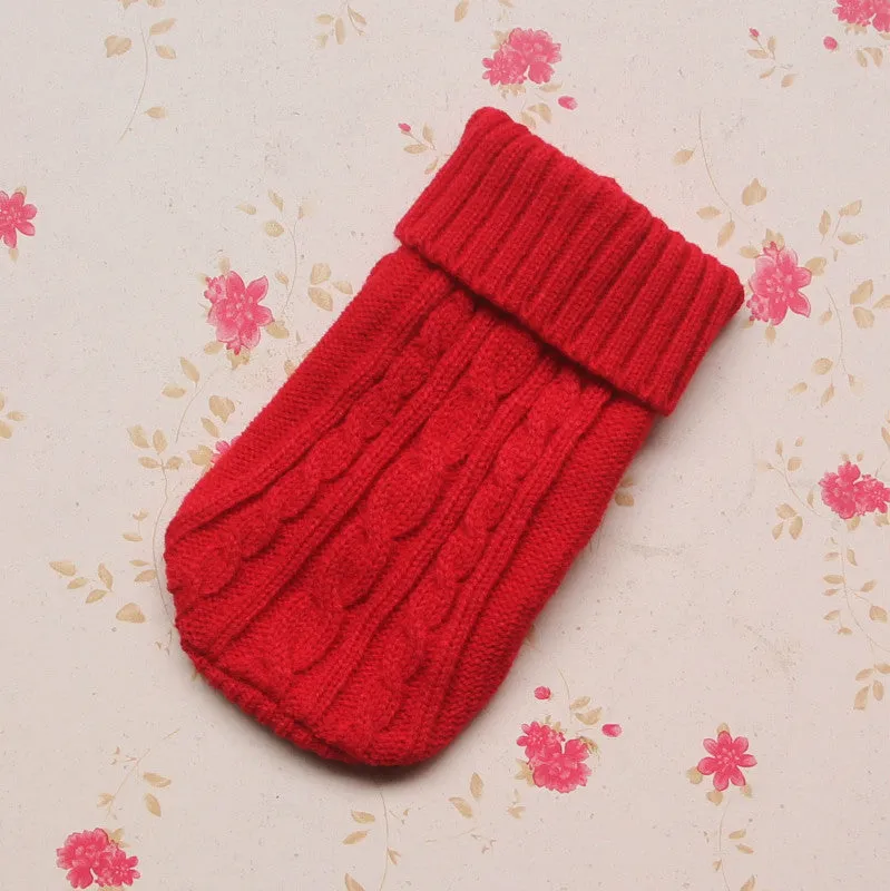 Knitted wool dog sweater with fabric buttons on a white background, shown in blue