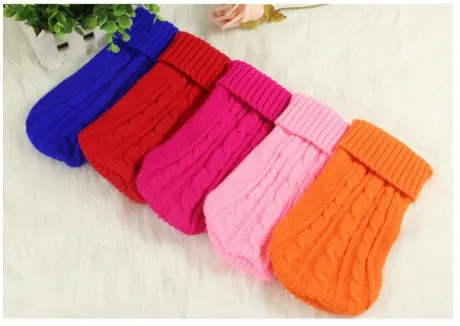 Knitted wool dog sweater with fabric buttons on a white background, shown in blue
