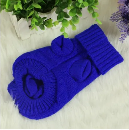 Knitted wool dog sweater with fabric buttons on a white background, shown in blue