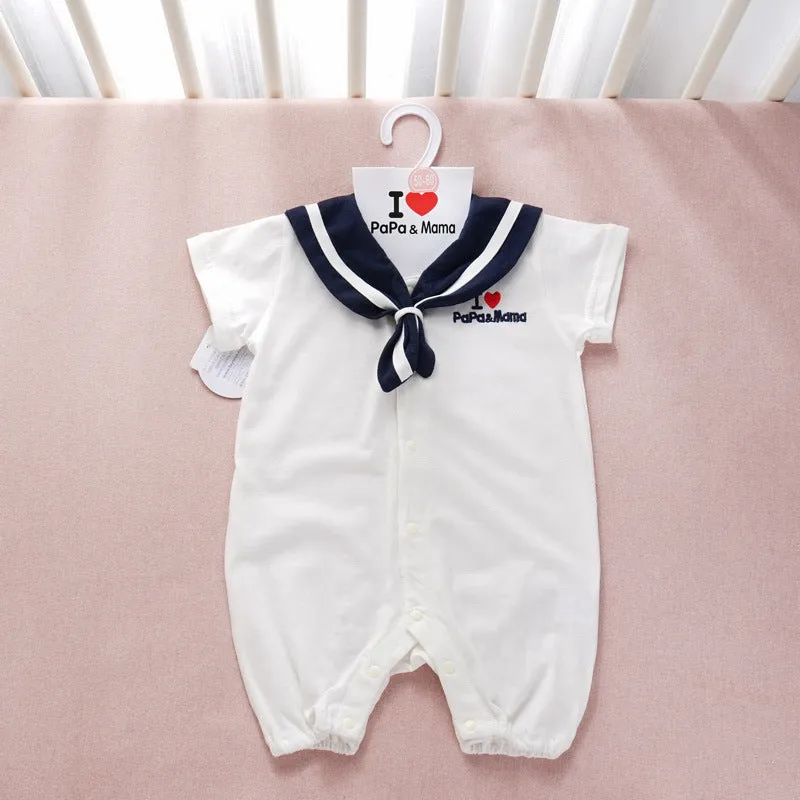 Navy cotton baby onesie with long sleeves and detachable hood on white background