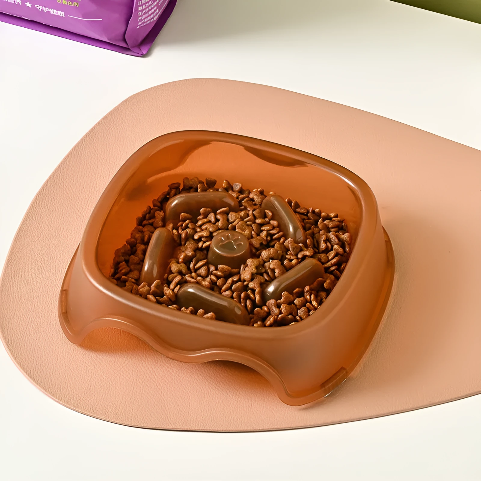Blue plastic dog slow feeder bowl with internal maze pattern for portion control.