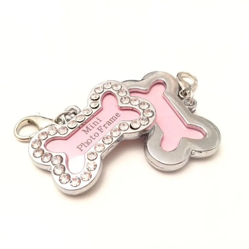 Pink metal dog pendant necklace with bone pattern diamond charm on display
