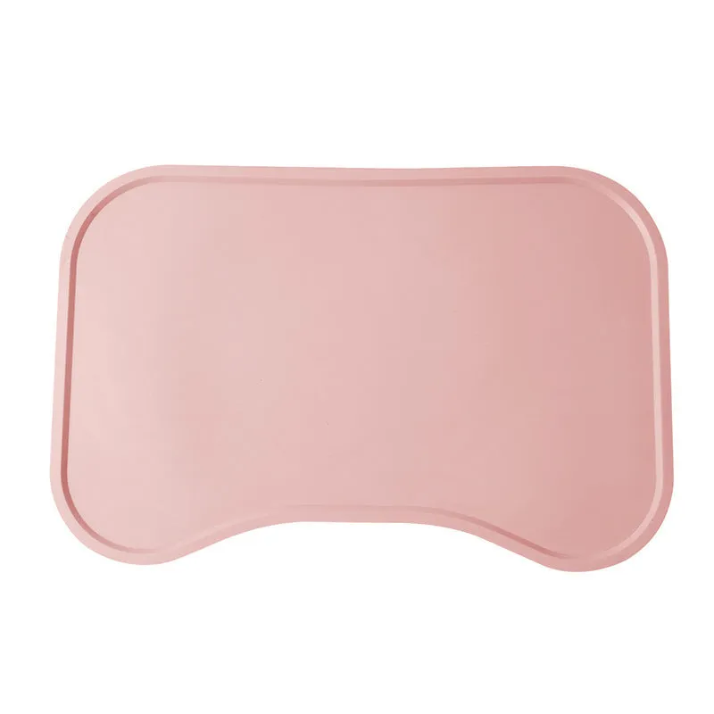 Waterproof silicone dog food mat with raised edges in green colour, non-slip base for pet bowls
