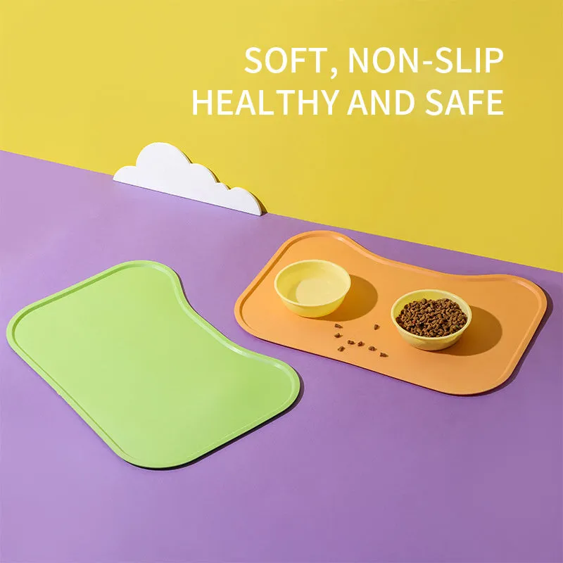 Waterproof silicone dog food mat with raised edges in green colour, non-slip base for pet bowls