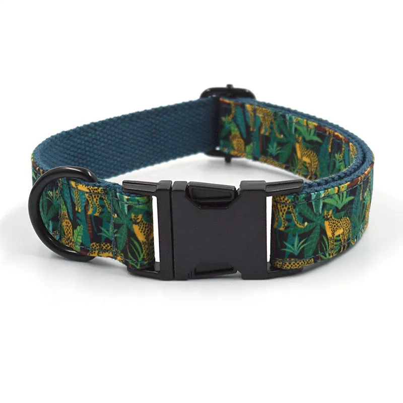 Green cloth pet collar and leash set with bowknot print on a white background showing collar and leash together