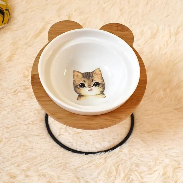Ceramic cat bowl holder with rack and cat face design, elevated to protect spine
