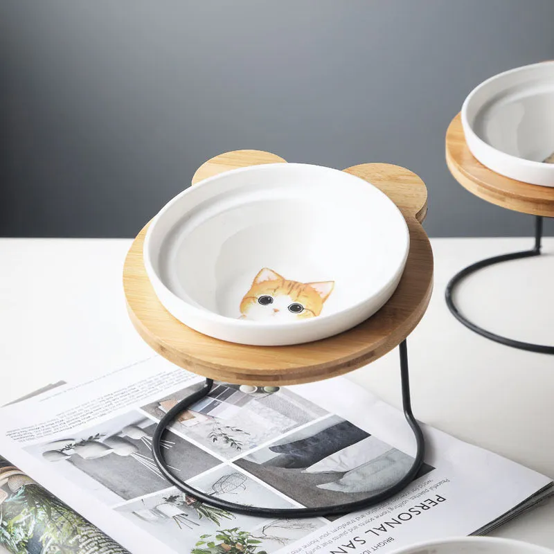 Ceramic cat bowl holder with rack and cat face design, elevated to protect spine