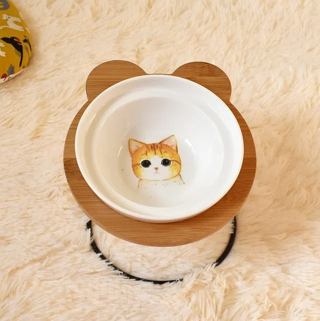 Ceramic cat bowl holder with rack and cat face design, elevated to protect spine