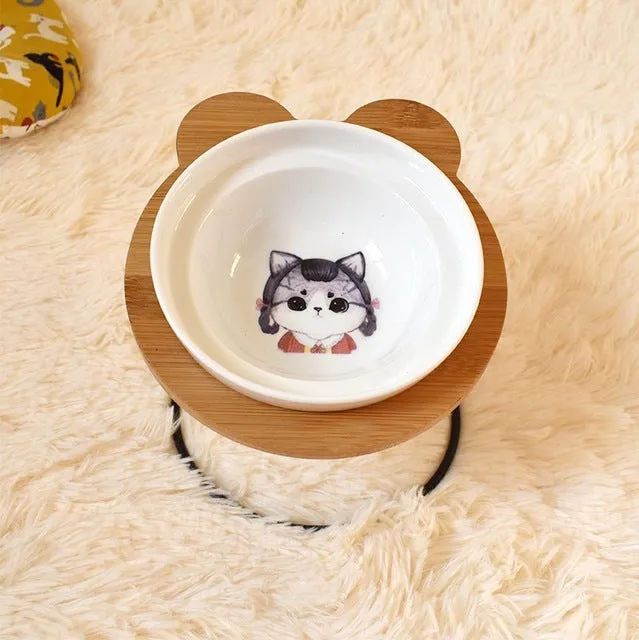 Ceramic cat bowl holder with rack and cat face design, elevated to protect spine