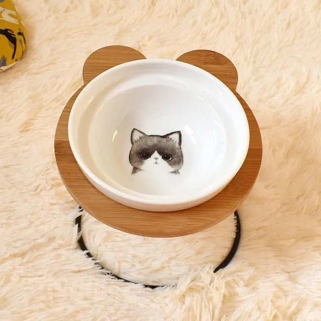 Ceramic cat bowl holder with rack and cat face design, elevated to protect spine