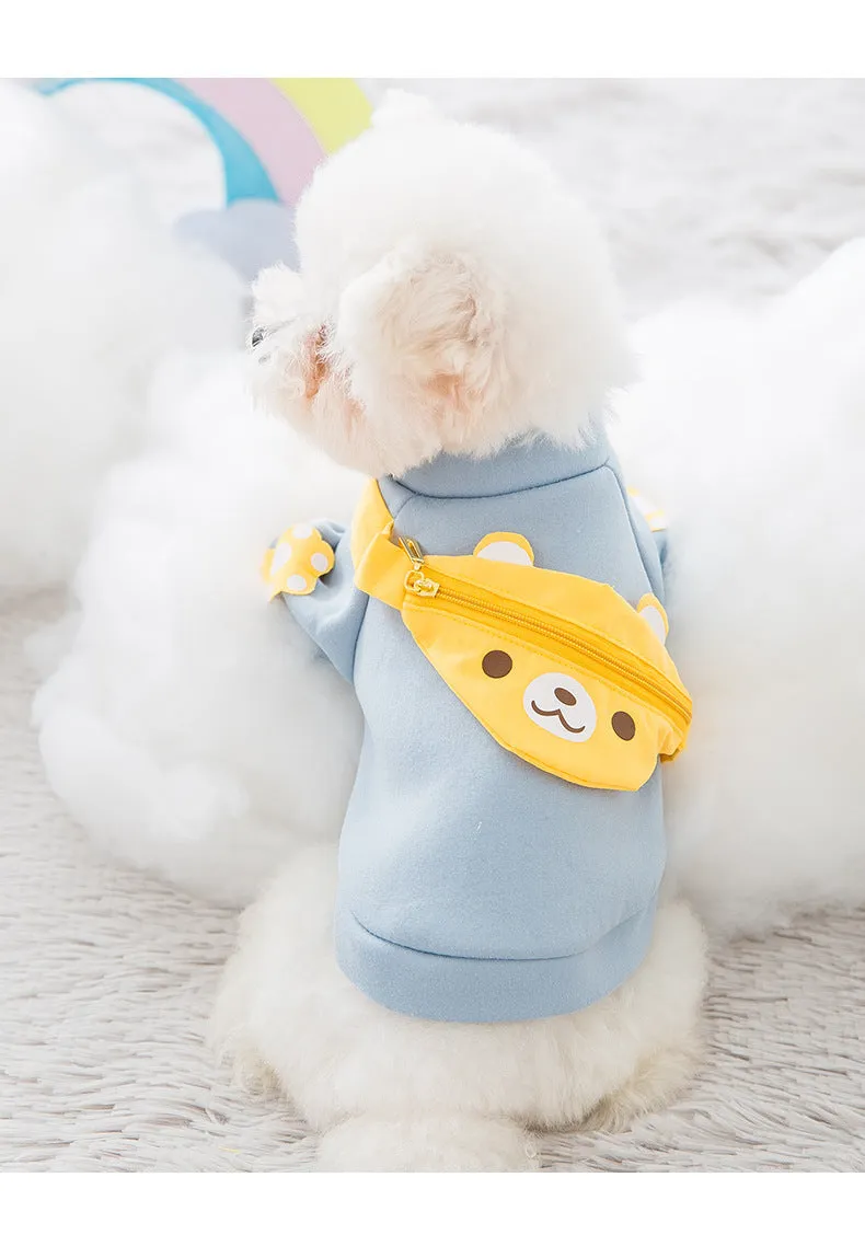 Blue cartoon backpack pet clothes milk silk sweater on small dog in side view
