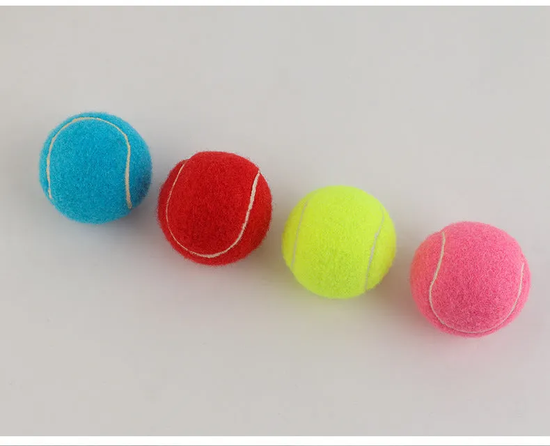 Bite-resistant rubber dog tennis ball in multiple colours including pink, blue and green