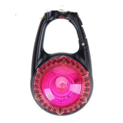 Pink LED flashing pet safety pendant clipped onto a collar with CR2032 batteries, showing 57x33mm ABS water-resistant build