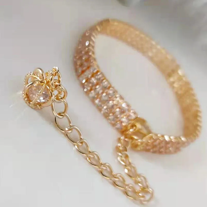 Gold dog collar with crown pattern and three drain diamond rhinestone detail on copper base