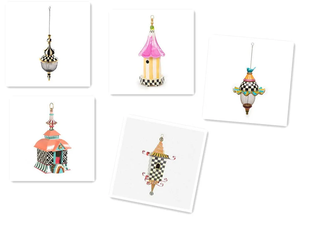 Iron metal bird feeder with creative pattern hanging from tree branch in garden
