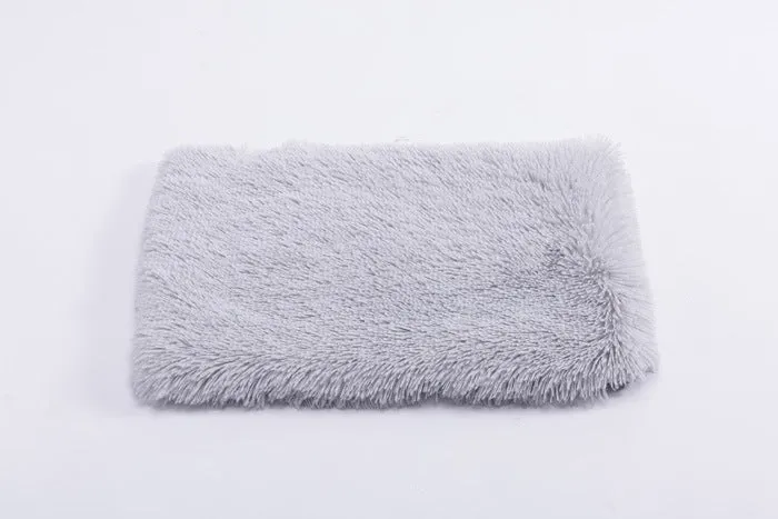 Plush pet nest with non-slip base, water-resistant material, available in multiple sizes and colours