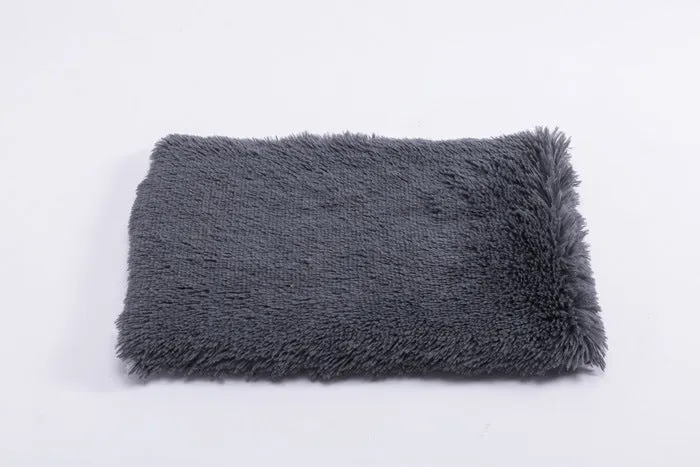 Plush pet nest with non-slip base, water-resistant material, available in multiple sizes and colours