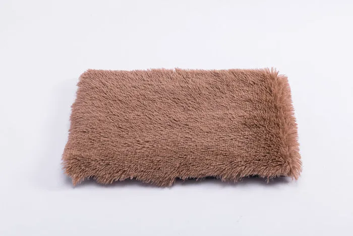 Plush pet nest with non-slip base, water-resistant material, available in multiple sizes and colours