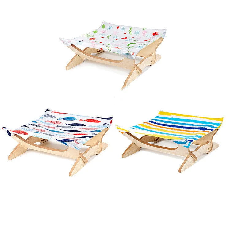 Wooden cat hammock with a striped passion stripe cloth cover on a wooden frame, sized for indoor cats