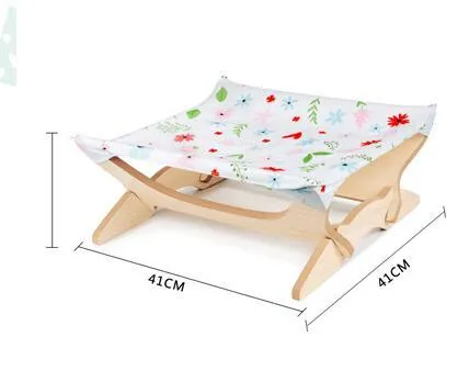Wooden cat hammock with a striped passion stripe cloth cover on a wooden frame, sized for indoor cats