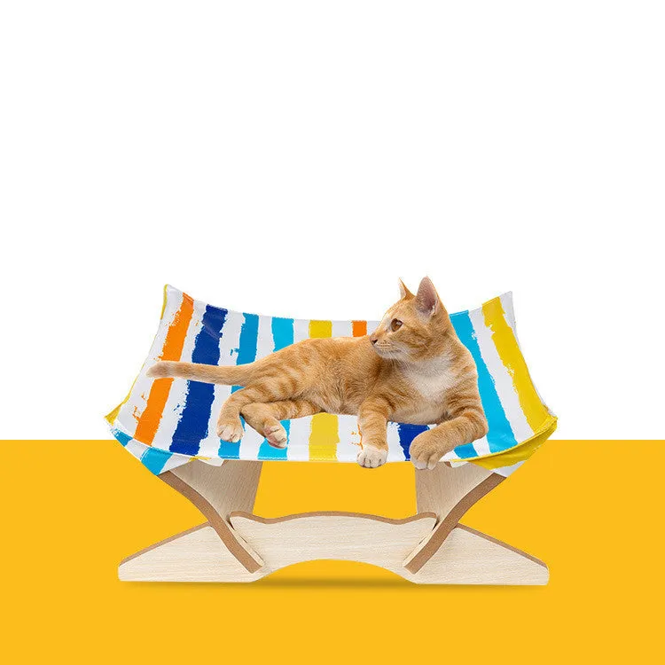 Wooden cat hammock with a striped passion stripe cloth cover on a wooden frame, sized for indoor cats