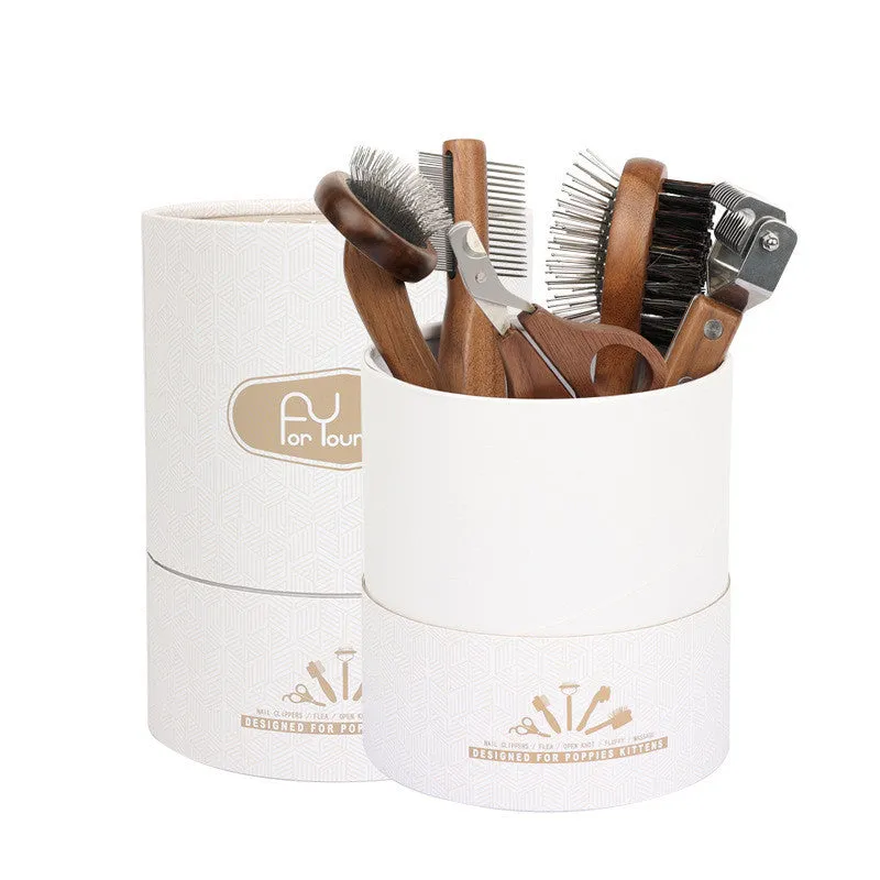 Wooden pet grooming set with comb, rake comb, and nail clippers in storage bucket