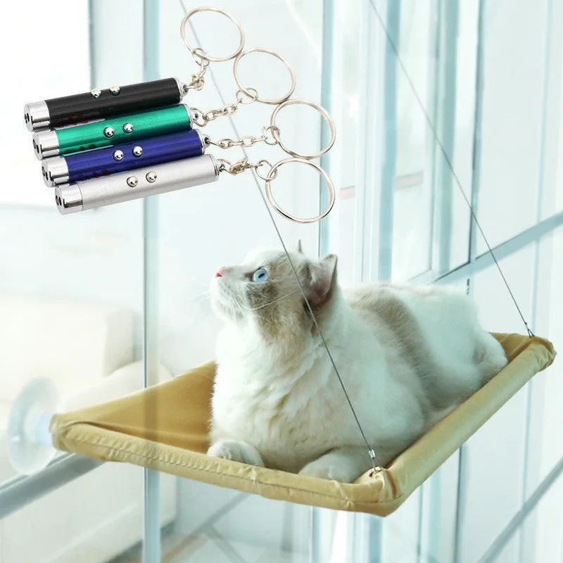Blue cat hammock with suction cups attached to a window, featuring breathable fabric and metal frame