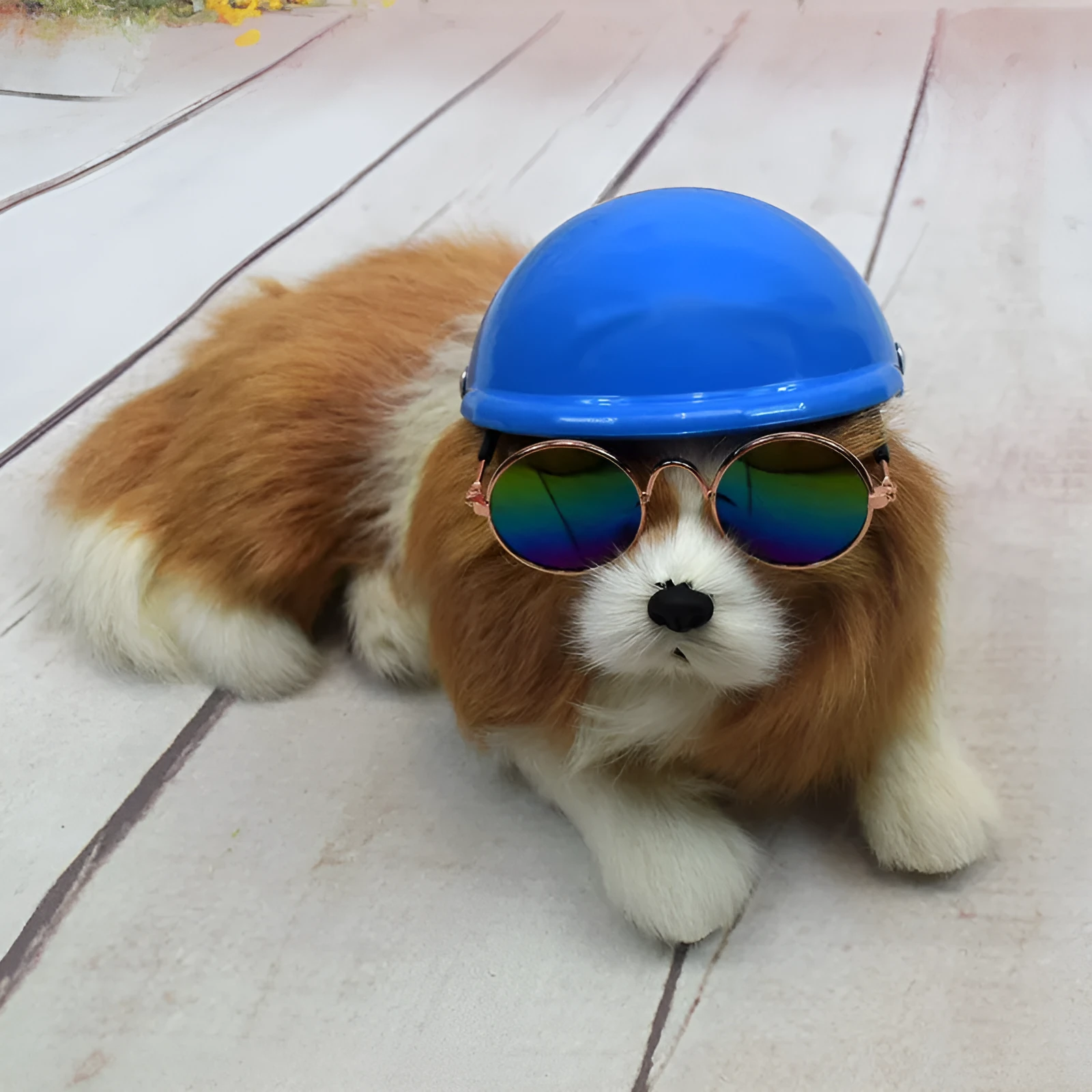 A pink plastic dog hat designed like a motorcycle helmet on a white background.