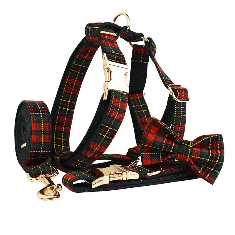 Christmas plaid green dog collar set with leash bow and vest on a festive background