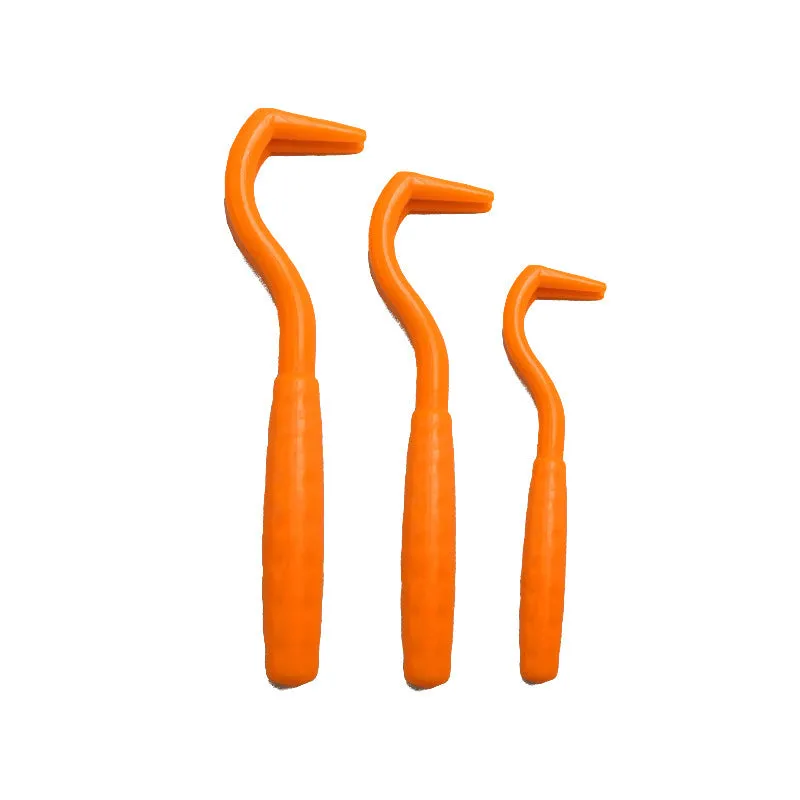 Set of three coloured plastic tick removal hooks for dogs on a white background.