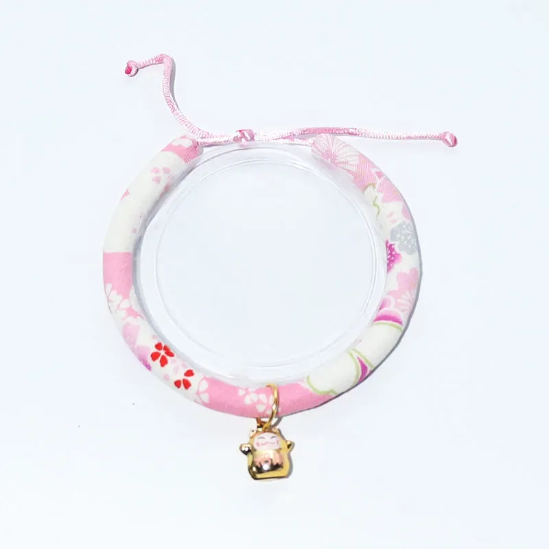 Cat collar with small Japanese bell made from cotton, linen, and copper, available in Black big flower and Red plum