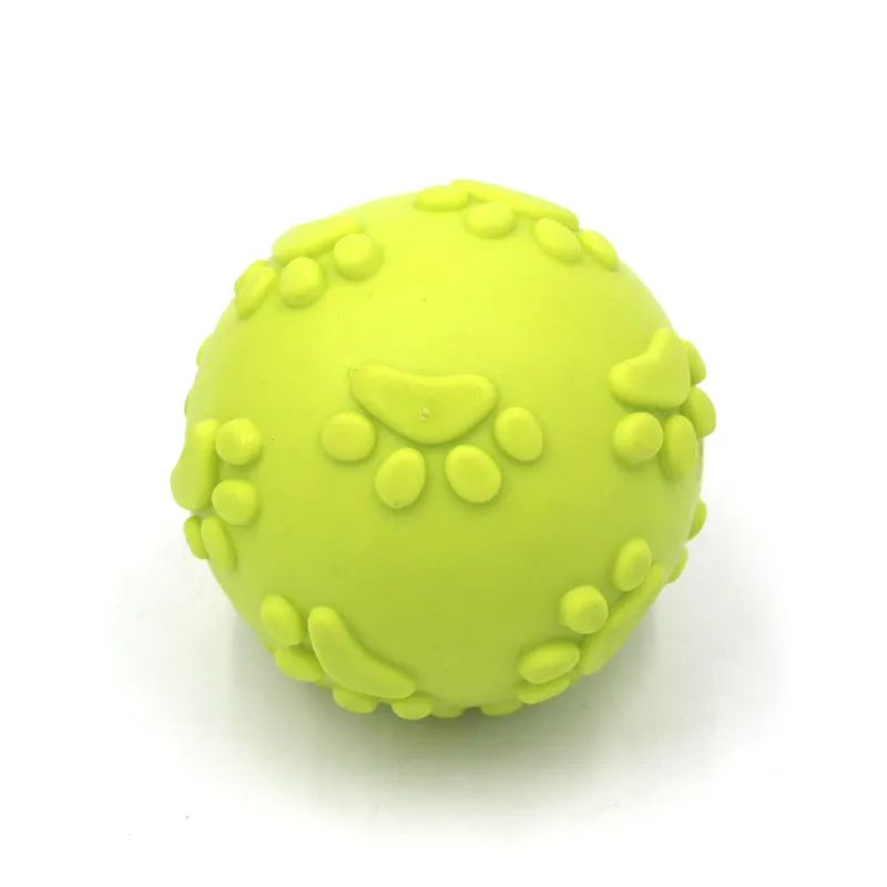 Blue TPR dog bite proof toy ball with built-in soundtrack, 6cm diameter on grass