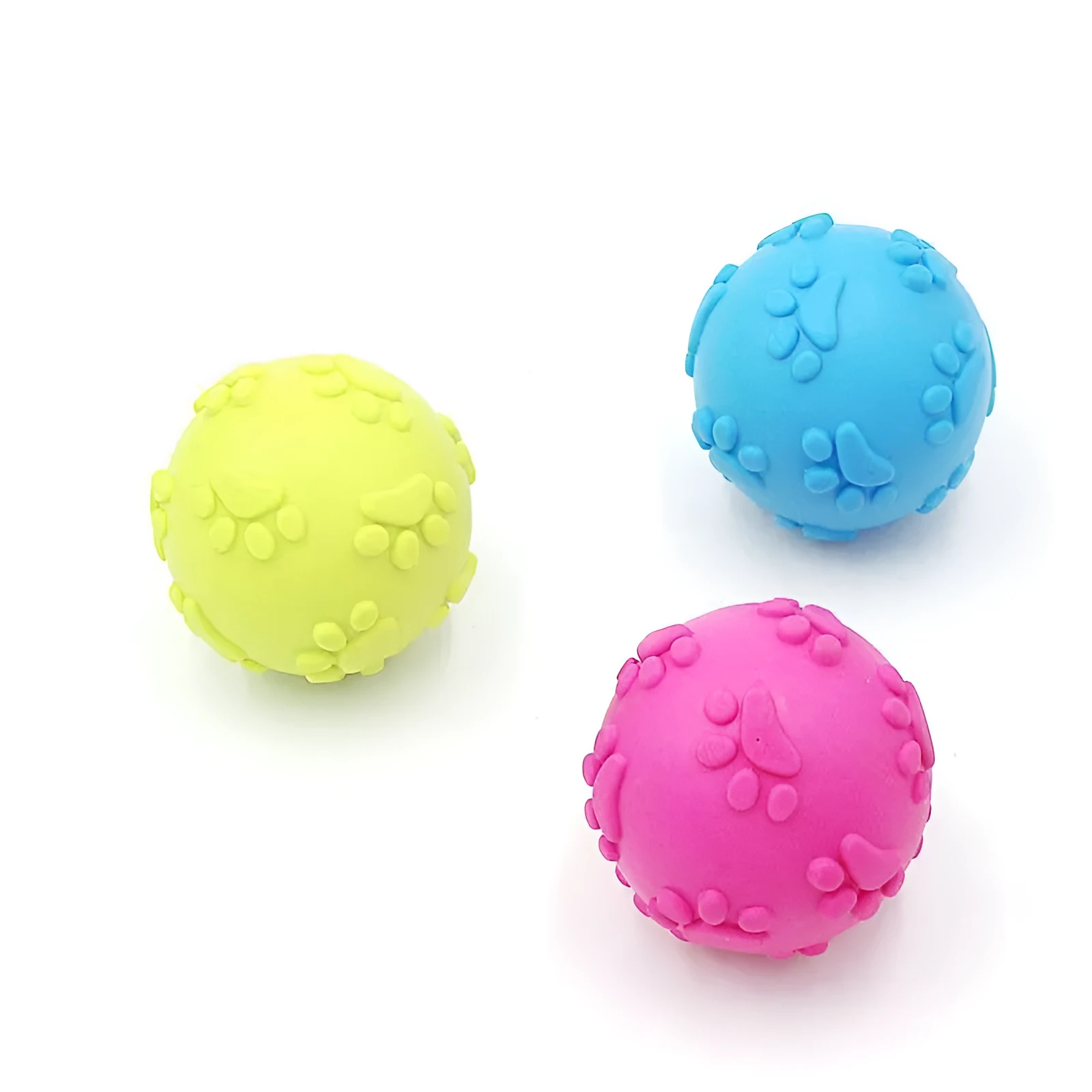 Blue TPR dog bite proof toy ball with built-in soundtrack, 6cm diameter on grass
