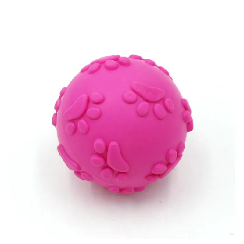 Blue TPR dog bite proof toy ball with built-in soundtrack, 6cm diameter on grass