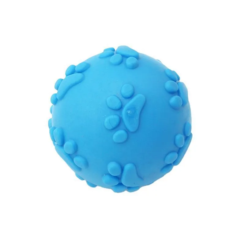 Blue TPR dog bite proof toy ball with built-in soundtrack, 6cm diameter on grass