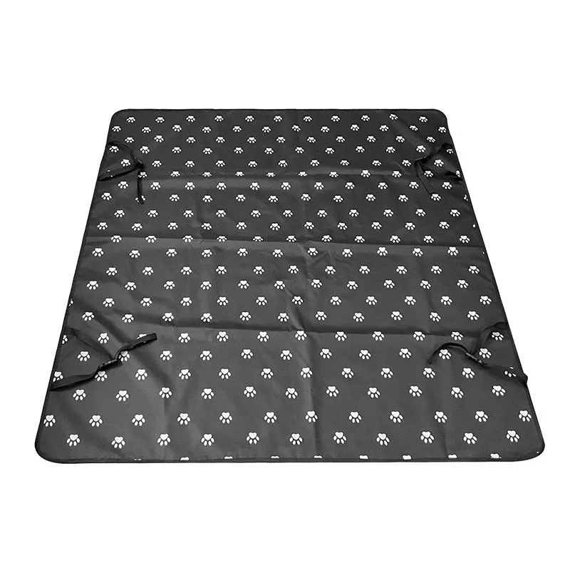 Water resistant dog car seat cover mat on a rear car seat in a bone print pattern.