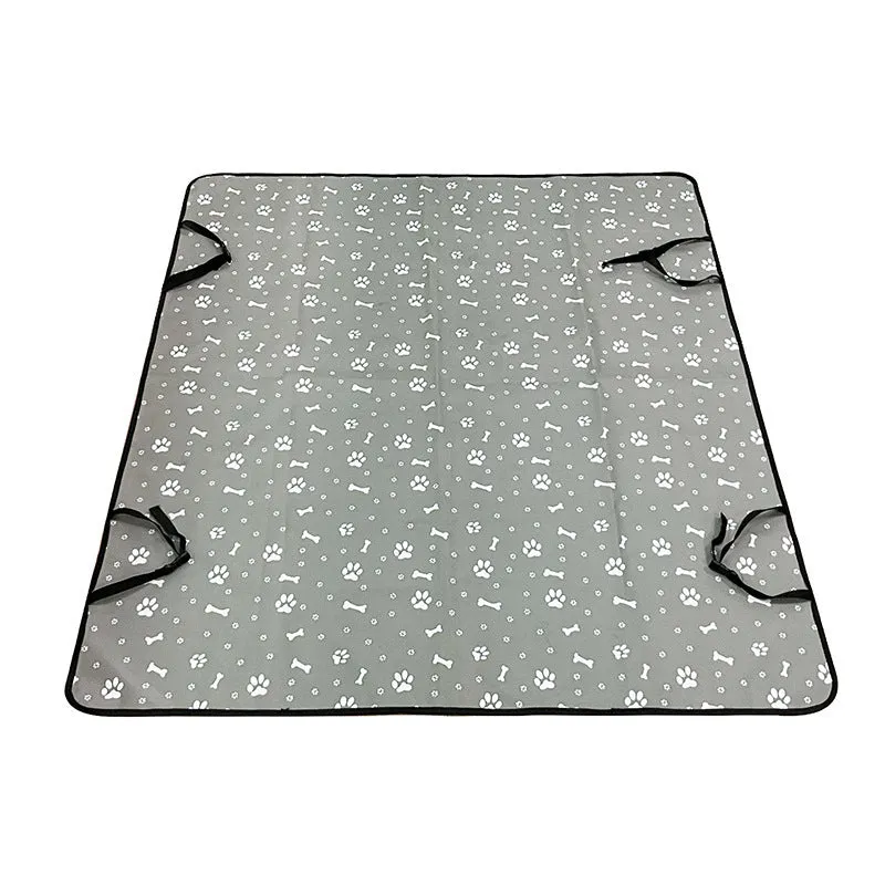 Water resistant dog car seat cover mat on a rear car seat in a bone print pattern.
