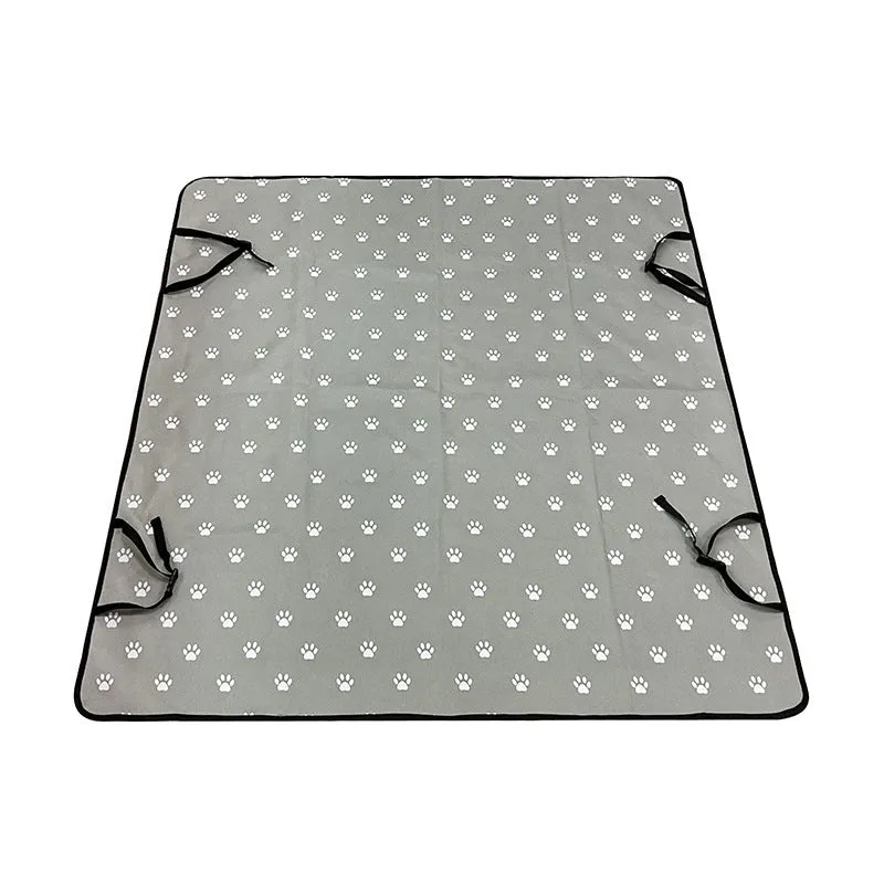 Water resistant dog car seat cover mat on a rear car seat in a bone print pattern.