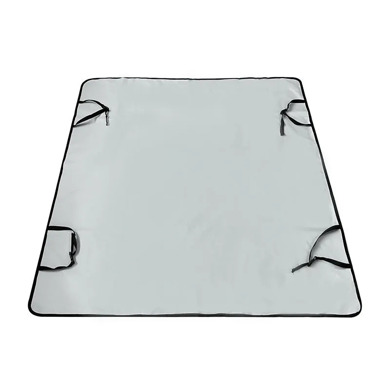 Water resistant dog car seat cover mat on a rear car seat in a bone print pattern.