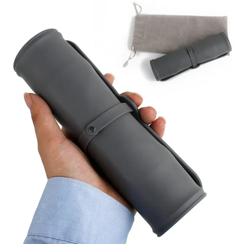 Collapsible silicone pet bowl in blue grey with velvet carry bag on a light background