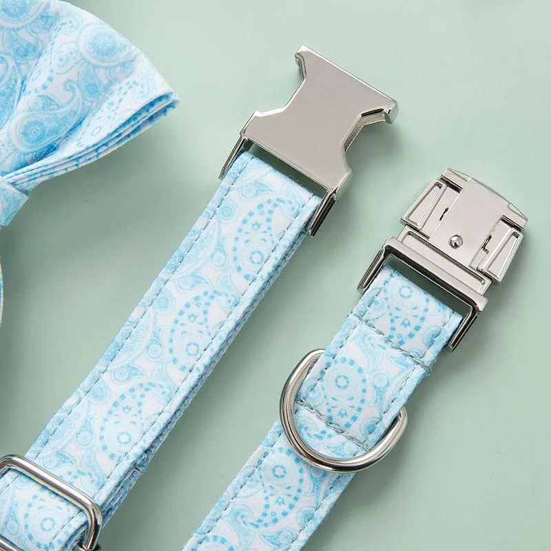 Paisley polyester dog collar with zinc alloy buckle and lettering on a white background.