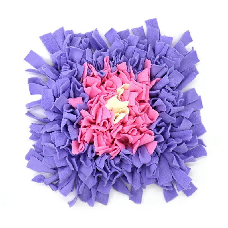 Plush dog sniffing pad with blue and yellow bud pattern on non-slip base
