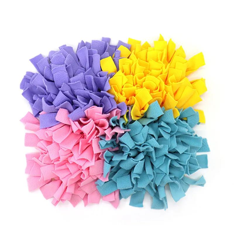 Plush dog sniffing pad with blue and yellow bud pattern on non-slip base