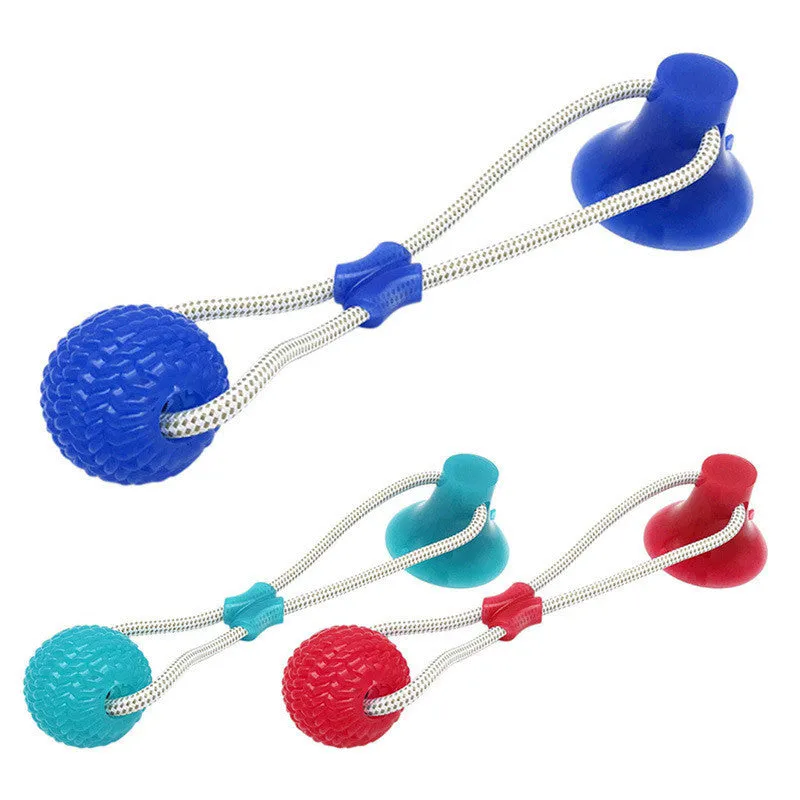 Pet dog rubber sucker molar toy in five colours blue green orange purple red on a light background