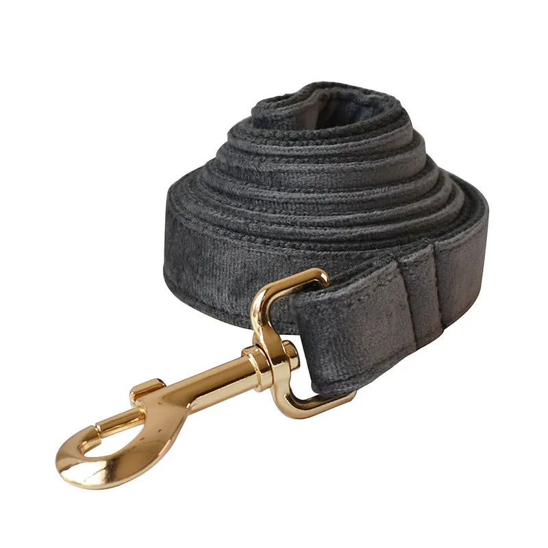 Silver grey polyester dog leash and collar set with alloy carabiner and bow detail on wooden floor