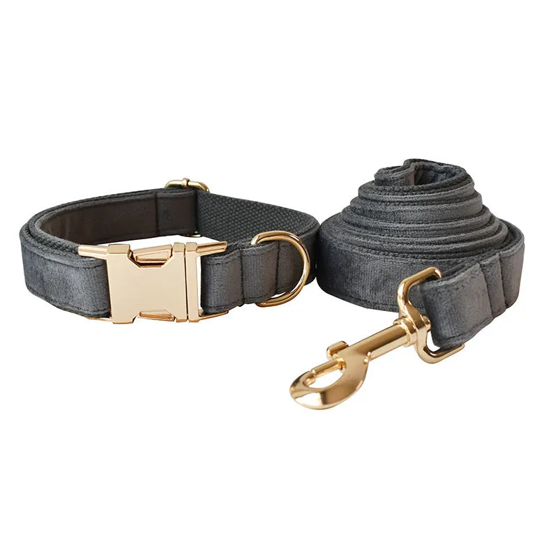Silver grey polyester dog leash and collar set with alloy carabiner and bow detail on wooden floor